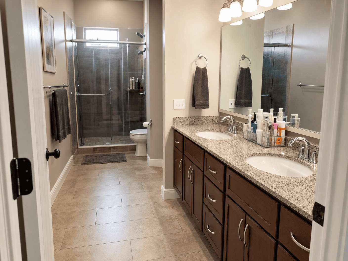 Immaculate bathroom with double vanity and glass shower