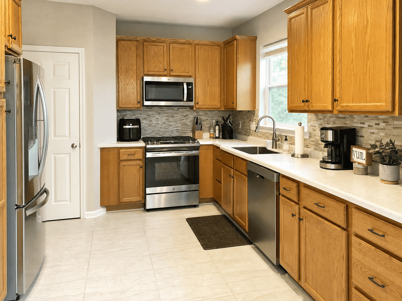 Warm wood-cabinet kitchen, spotlessly clean